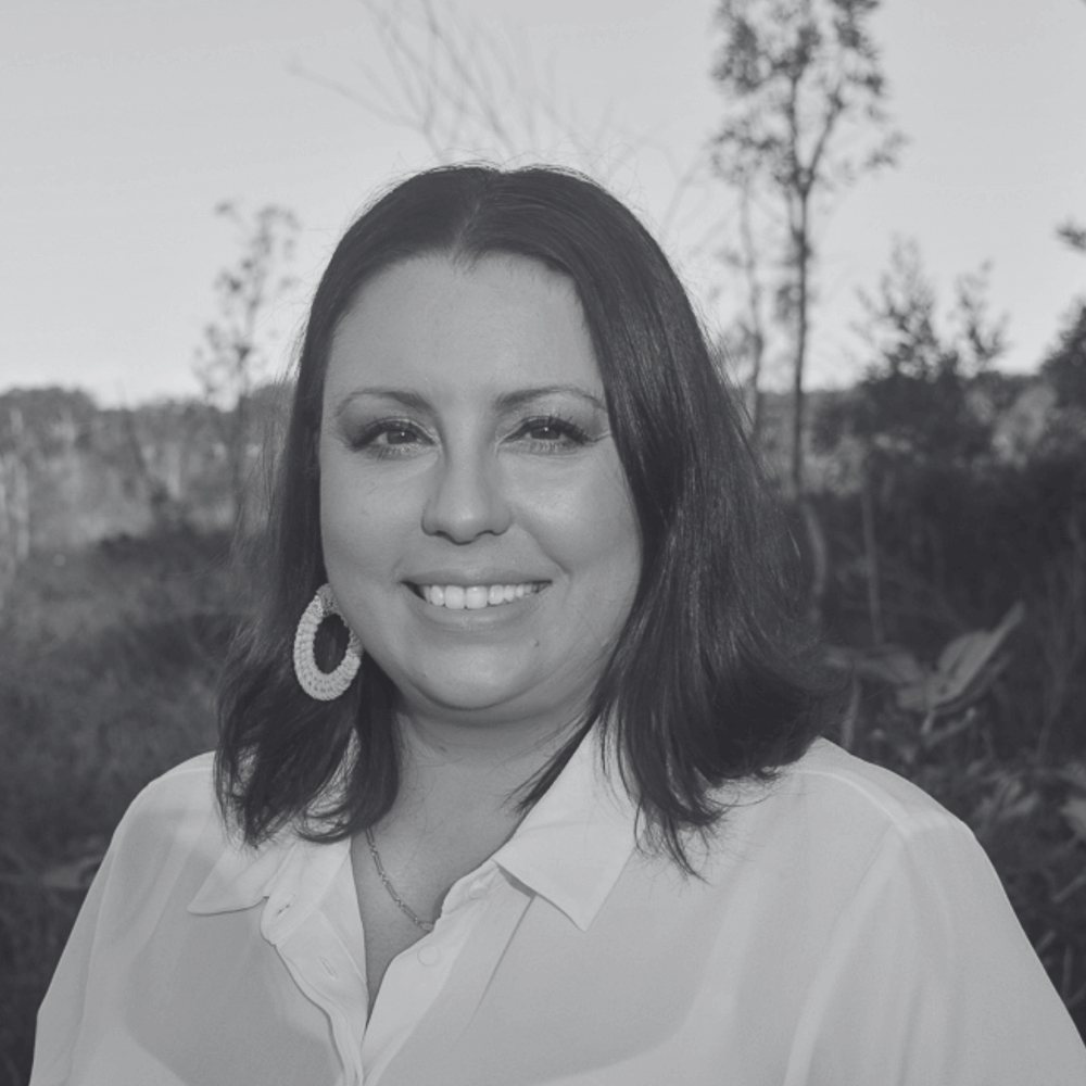 A black and white photo of Mandandanji woman and DeadlyScience Board member, Carly Forrest. 
